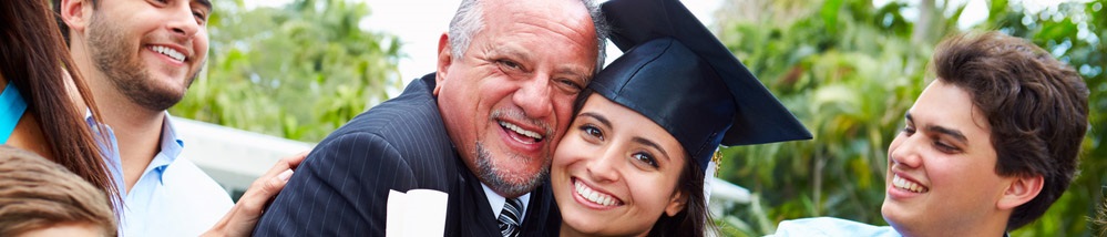 child and parent posing for graduation